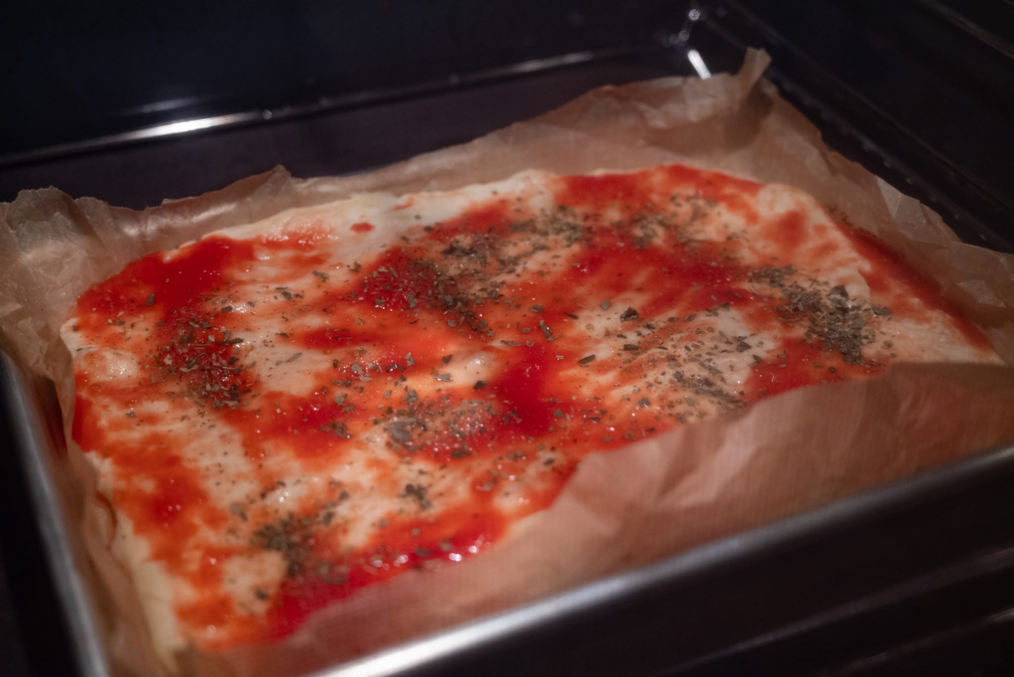 Pizza in teglia baking in the oven