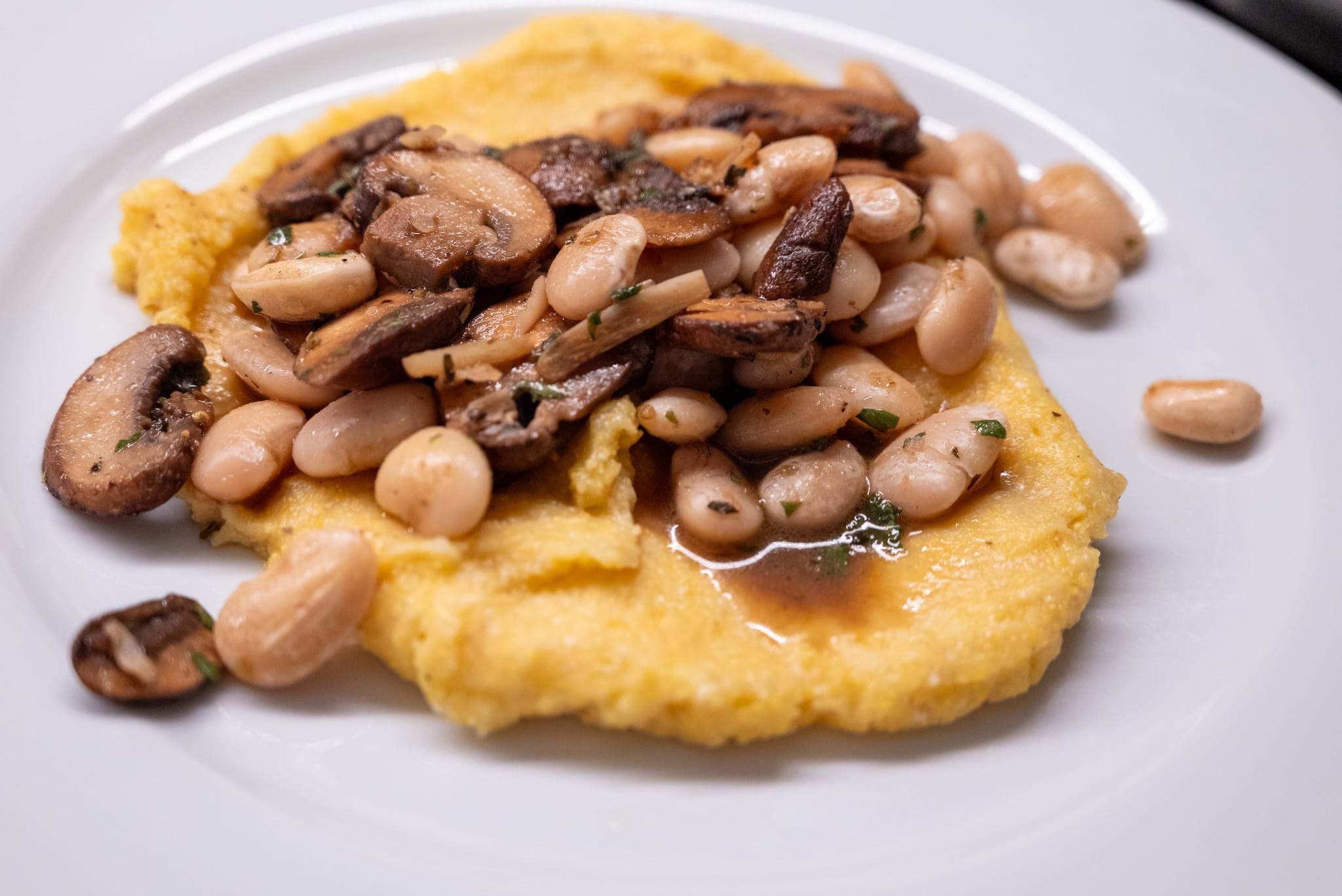 Mushrooms and white beans over polenta