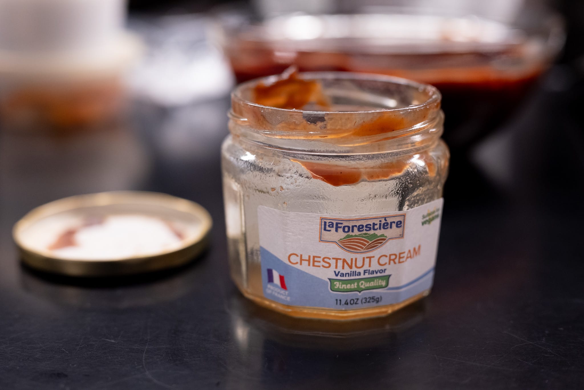 An empty jar of <em>crème de marrons</em>