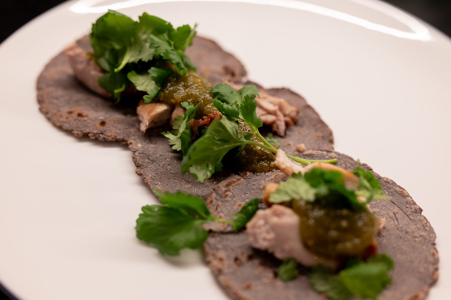 Three tacos on a plate