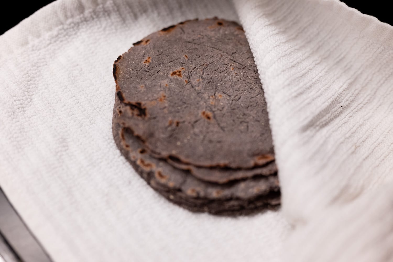 Tortillas in a kitchen towel