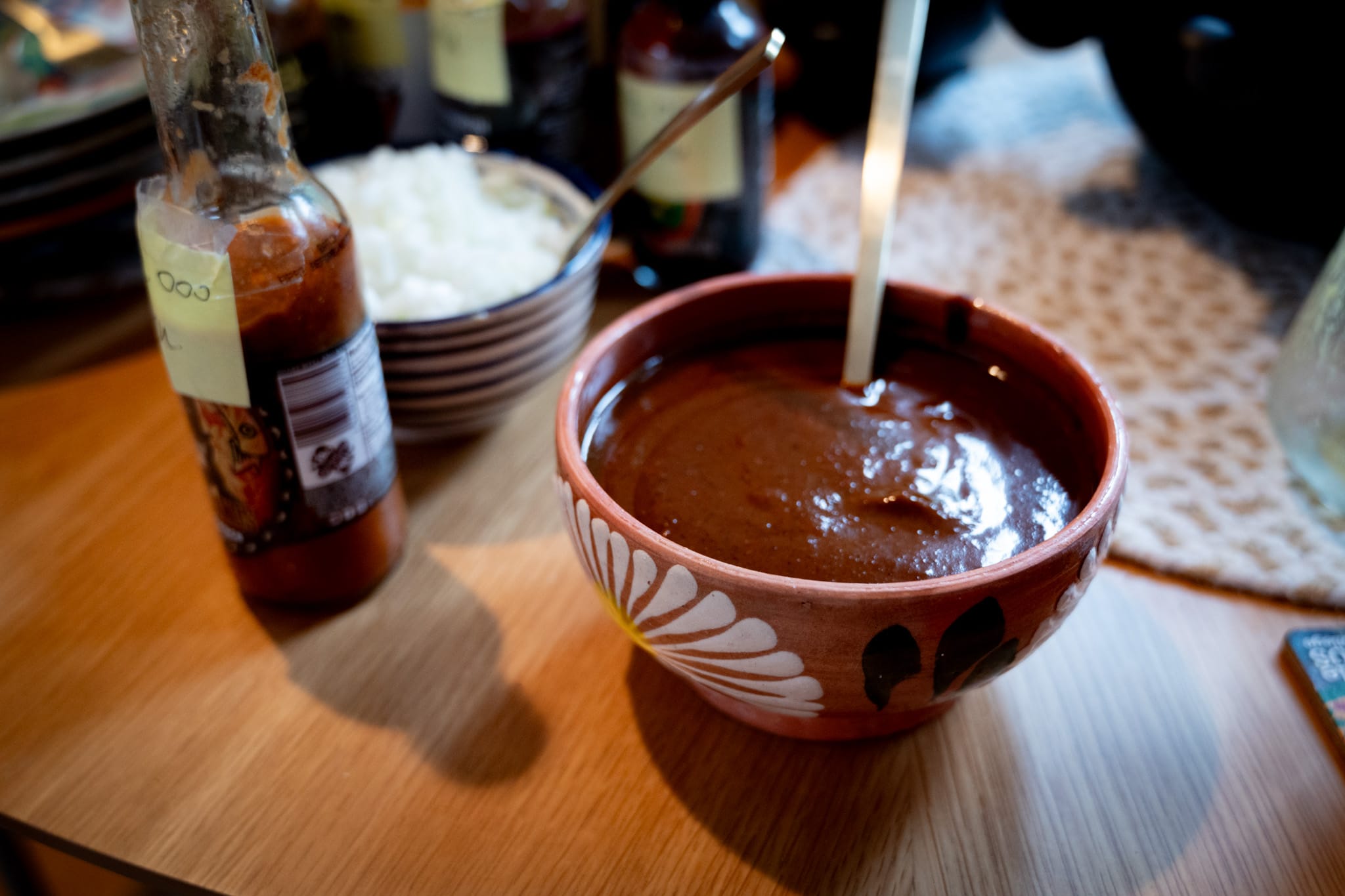 A bowl of mole sauce on a table