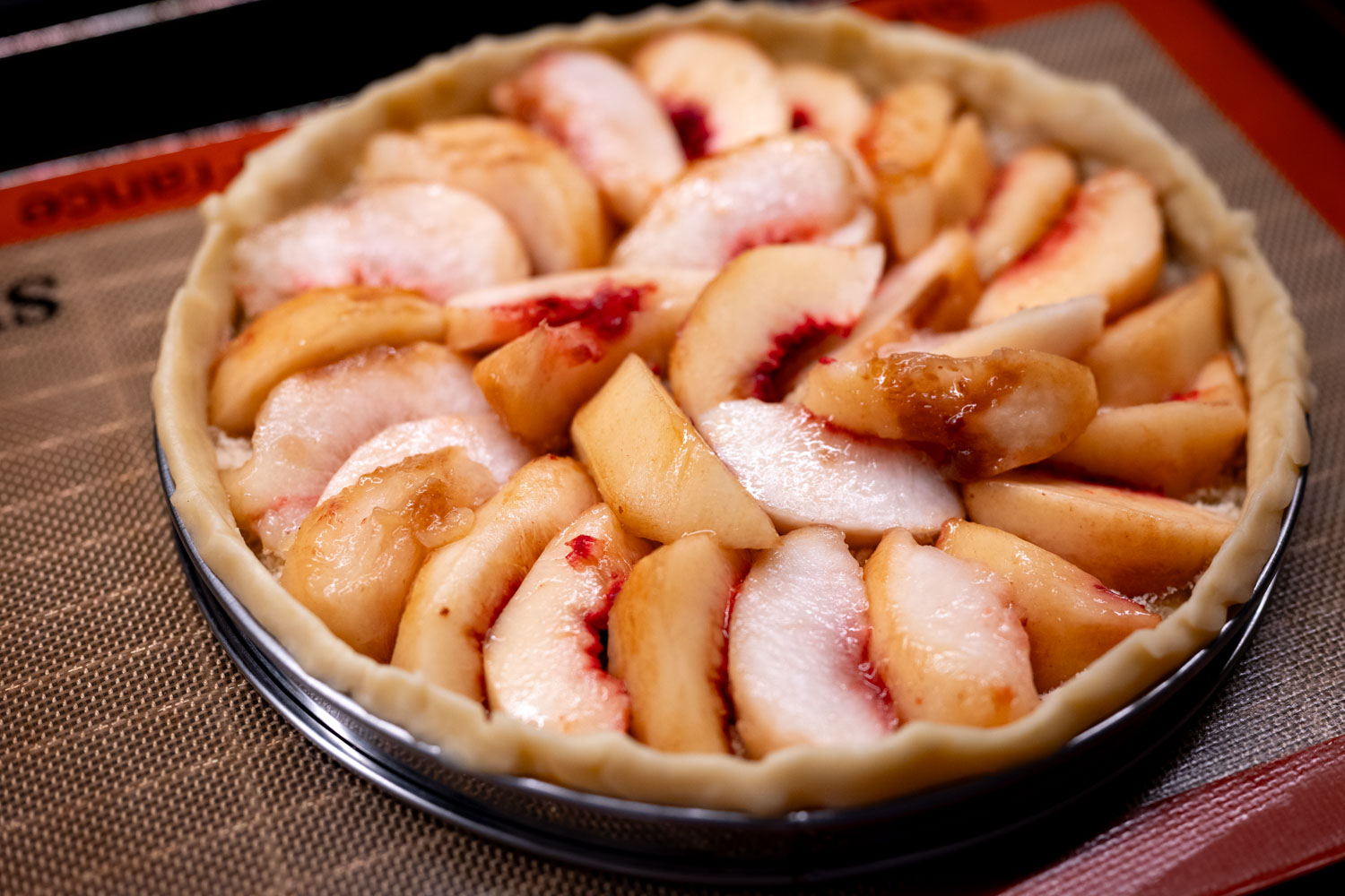 Peach tart ready to bake