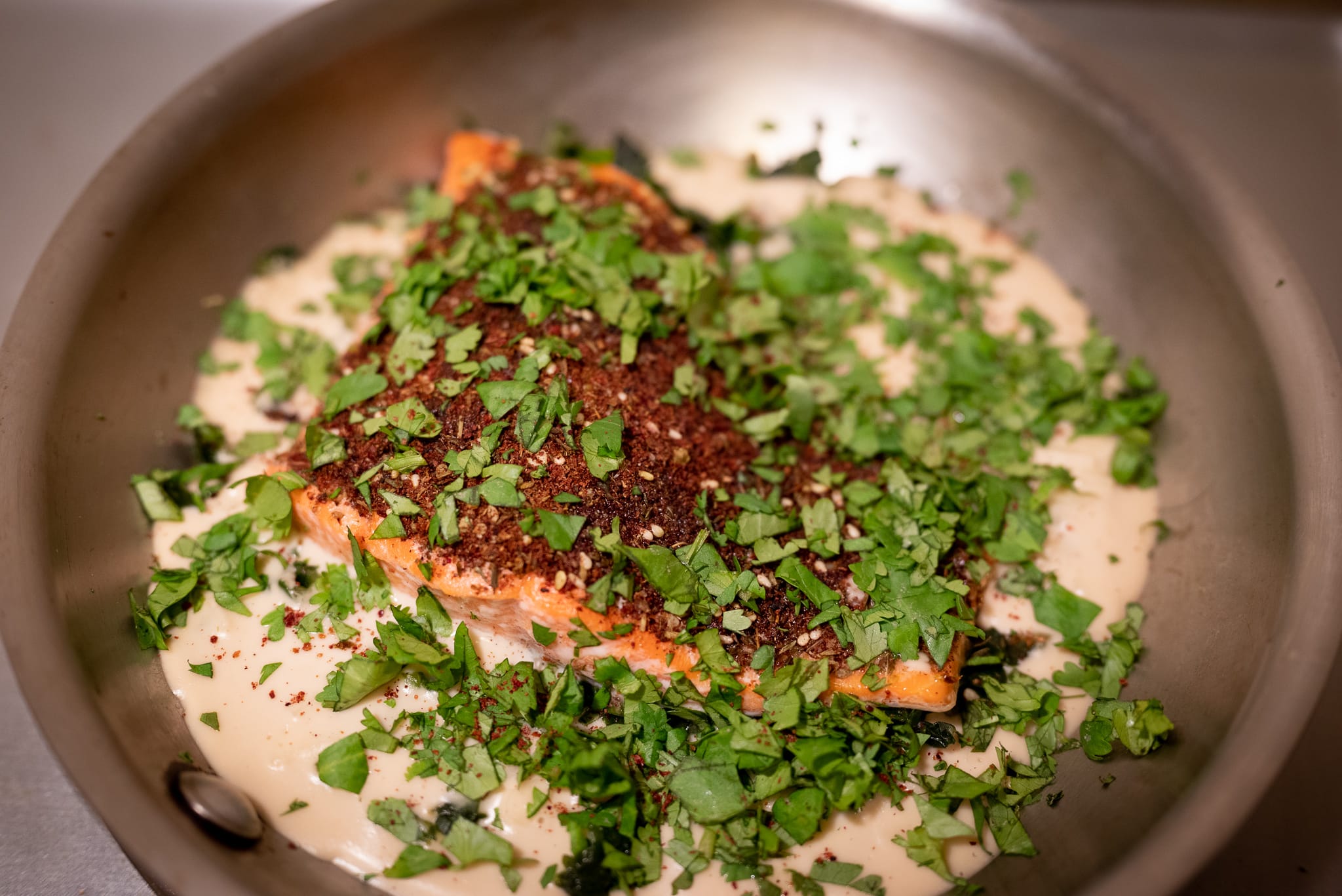 Za&rsquo;atar crusted salmon with tahini sauce and greens