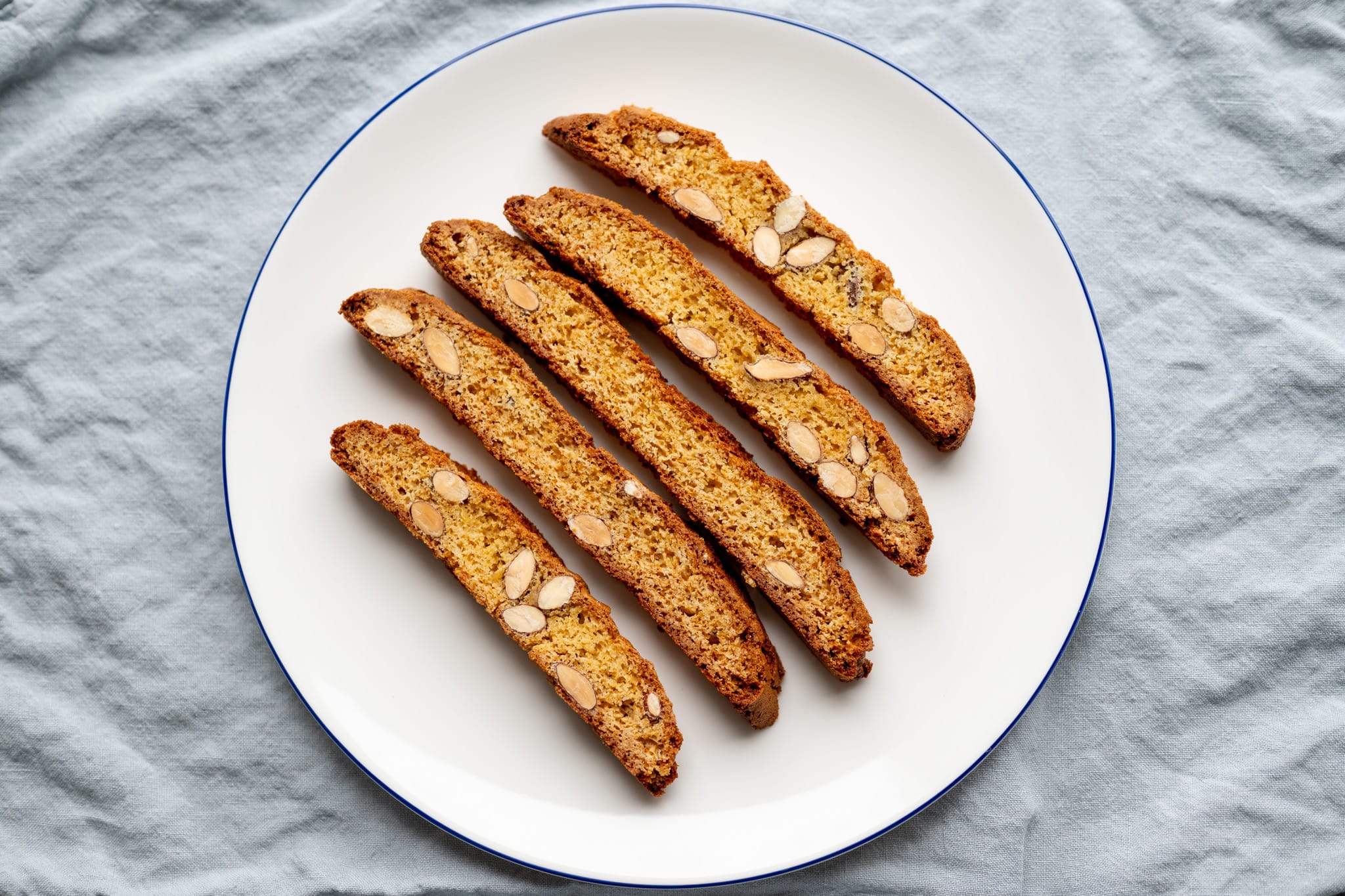 Top down view of cantuccini biscuits sitting on a plate