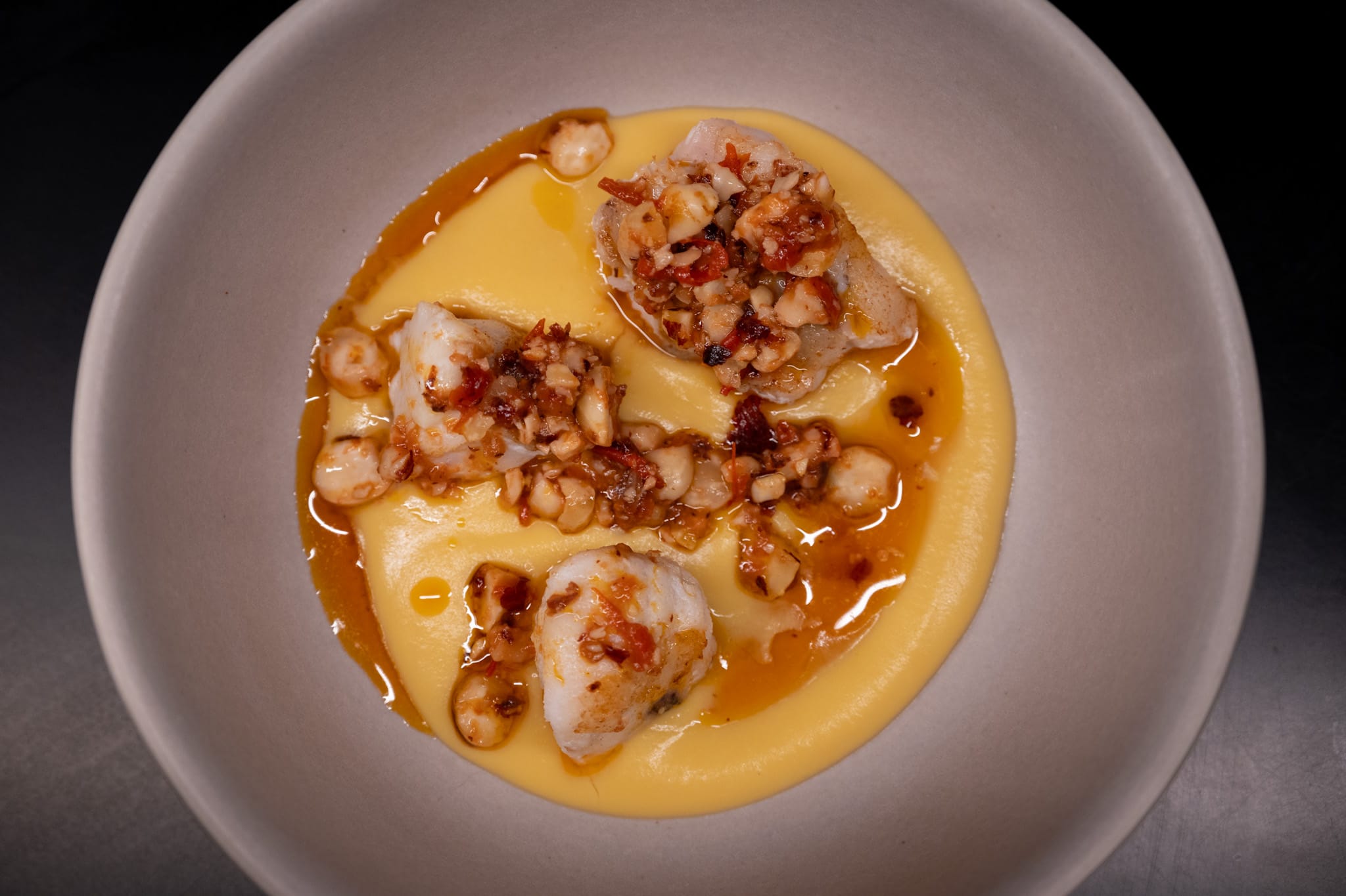 Monkfish on a squash velouté with hazelnut crunch