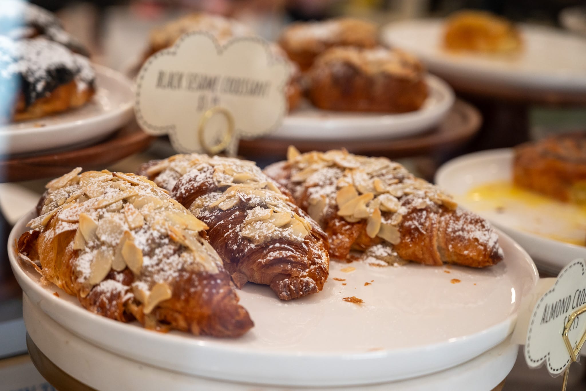 Almond croissants in a display case