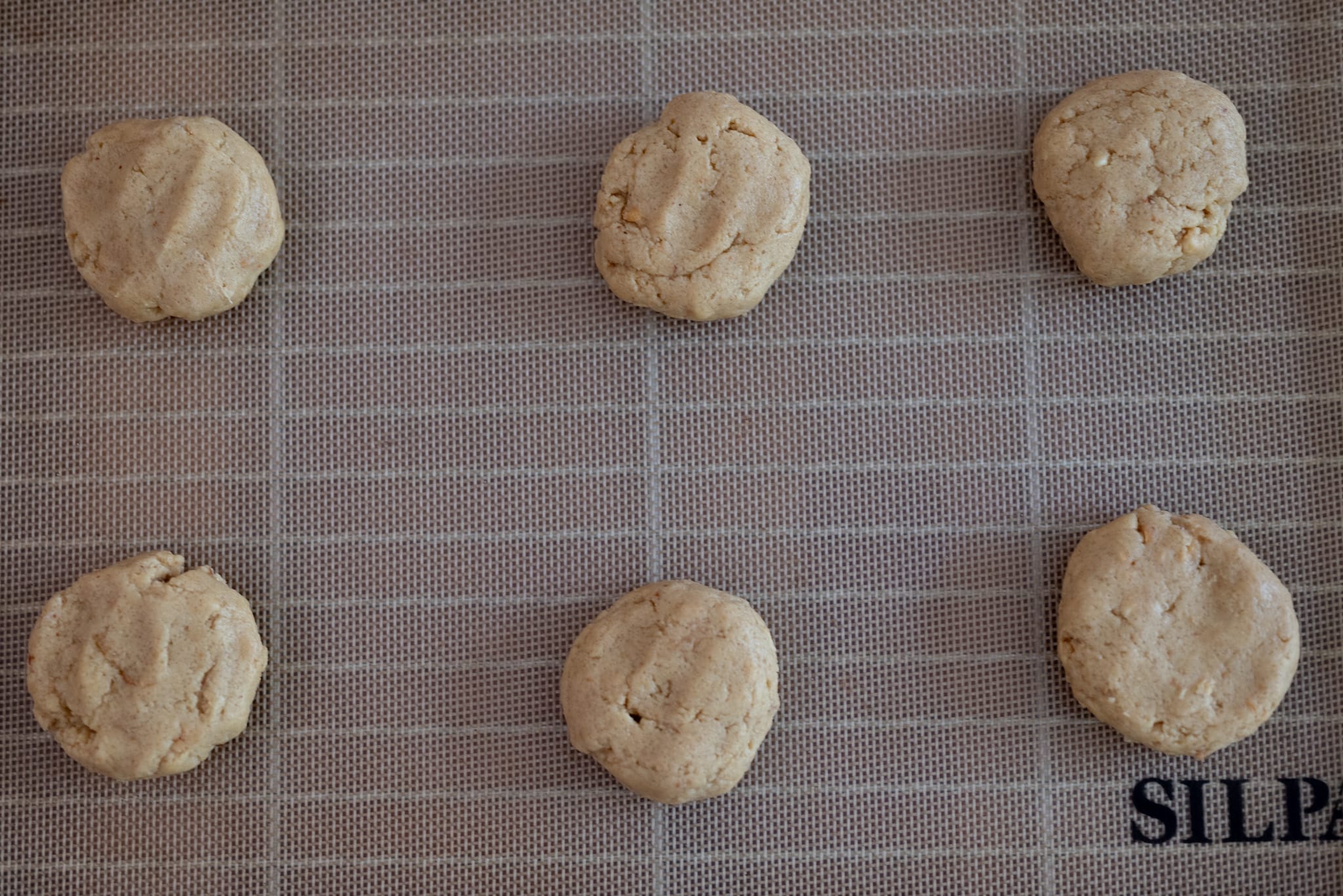Cookies on a Silpat ready to go in the oven